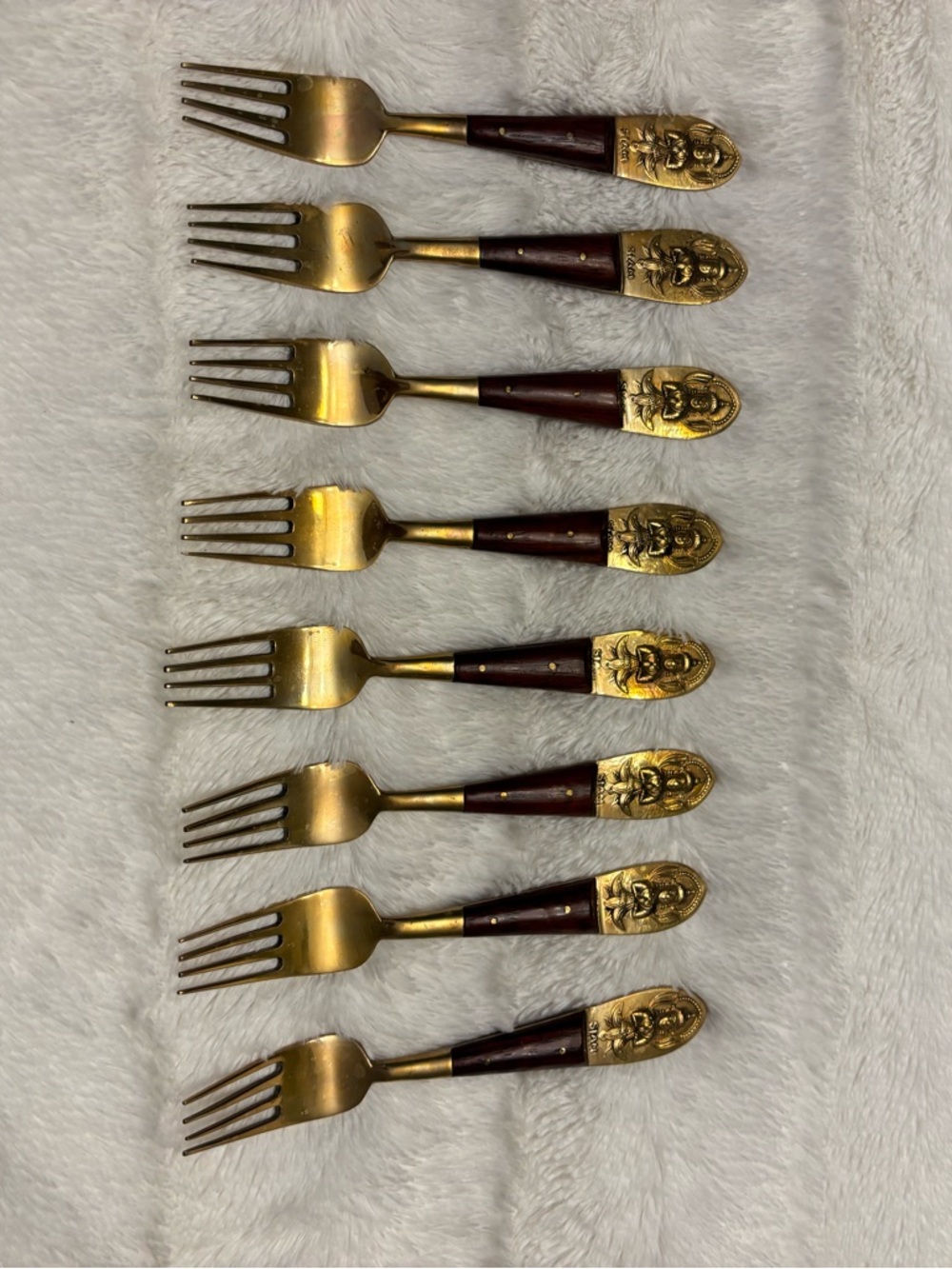 Set of eight vintage Siam Buddha brass and wood appetizer forks